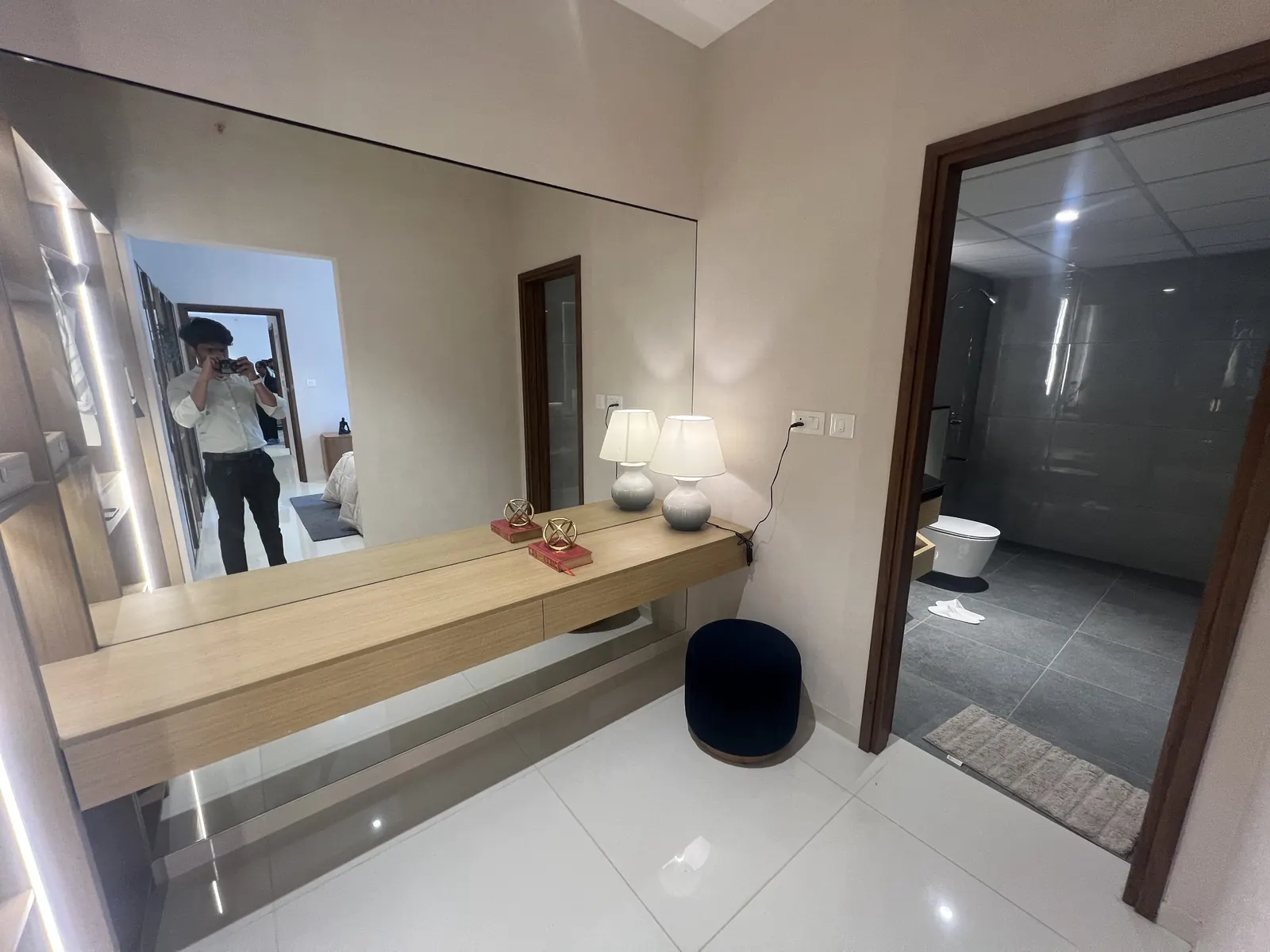 Featured Image of Godrej Vanantara 3 BHK (3T) Model Apartment Master Dressing Area with large mirror and bathroom entry